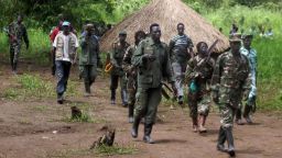 Photo dated on September 20, 2008 shows a column of around 40 Lord's Resistance Army (LRA) fighters emerging from a thick bush at Ri-Kwangba on southern Sudan's border with the Democratic Republic of Congo, one of two neutral camps where the LRA are to gather under a landmark truce as signed last month with Uganda. The Ugandan government said on February 19, 2008 it was close to signing a final peace deal with Lord's Resistance Army (LRA) rebels after an agreement on setting up national courts to handle the group's crimes. AFP PHOTO/STRINGER (Photo credit should read STRINGER/AFP/Getty Images)