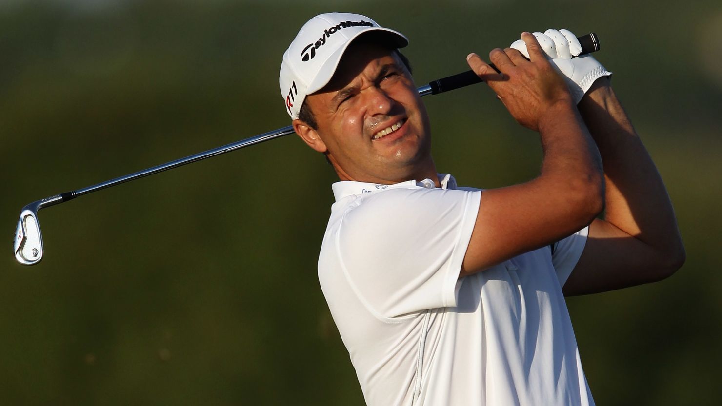 Simon Khan of England plays his second shot on the second hole at Oceanico Victoria Golf Course on Friday.