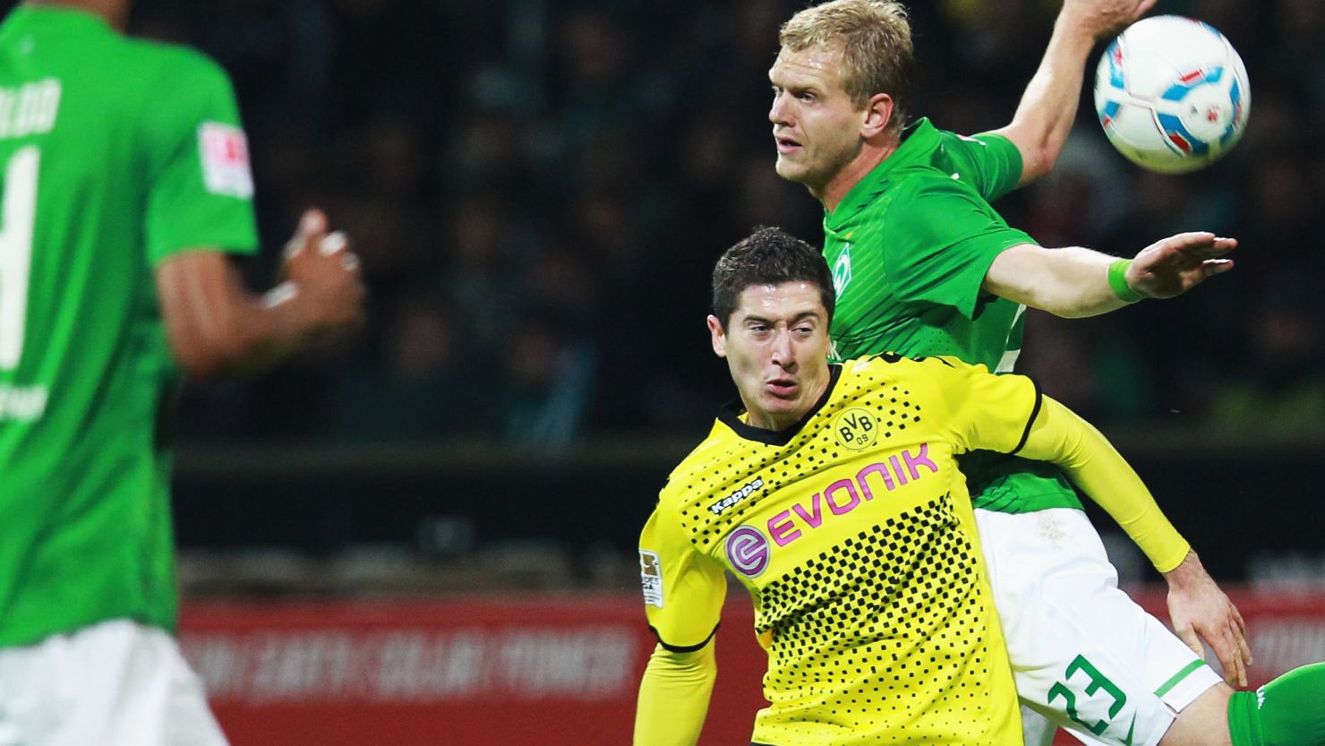 Bremen's Andreas Wolf (23) battles with Dortmund's hero and villain Ivan Perisic at Weser Stadium on Friday. .