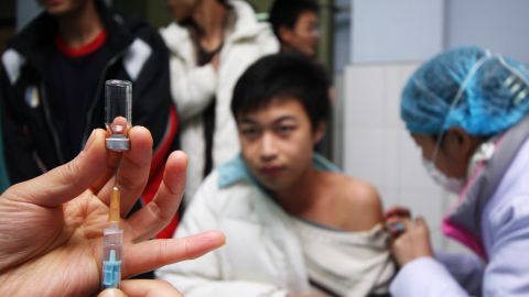 A file photo shows a student receiving a vaccine at a hospital in China's Chongqing municipality in 2009.