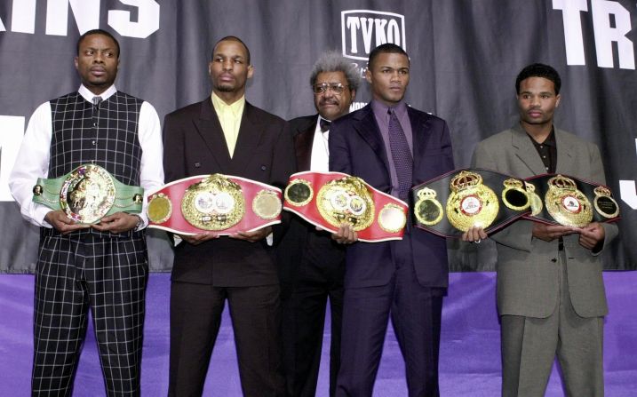 Hopkins (second from the left), holding his IBF middleweight championship belt, is pictured here alongside legendary boxing promoter Don King (center) at New York's Madison Square Garden in 2001. Also shown are WBC middleweight champion Keith Holmes (left), WBA belt holder Felix Trinidad Jr. and two-time WBA champion Williams Joppy. 