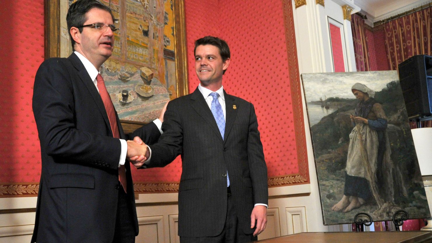 French Ambassador François Delattre, left, shakes hands with ICE Director John Morton during the ceremony Thursday.