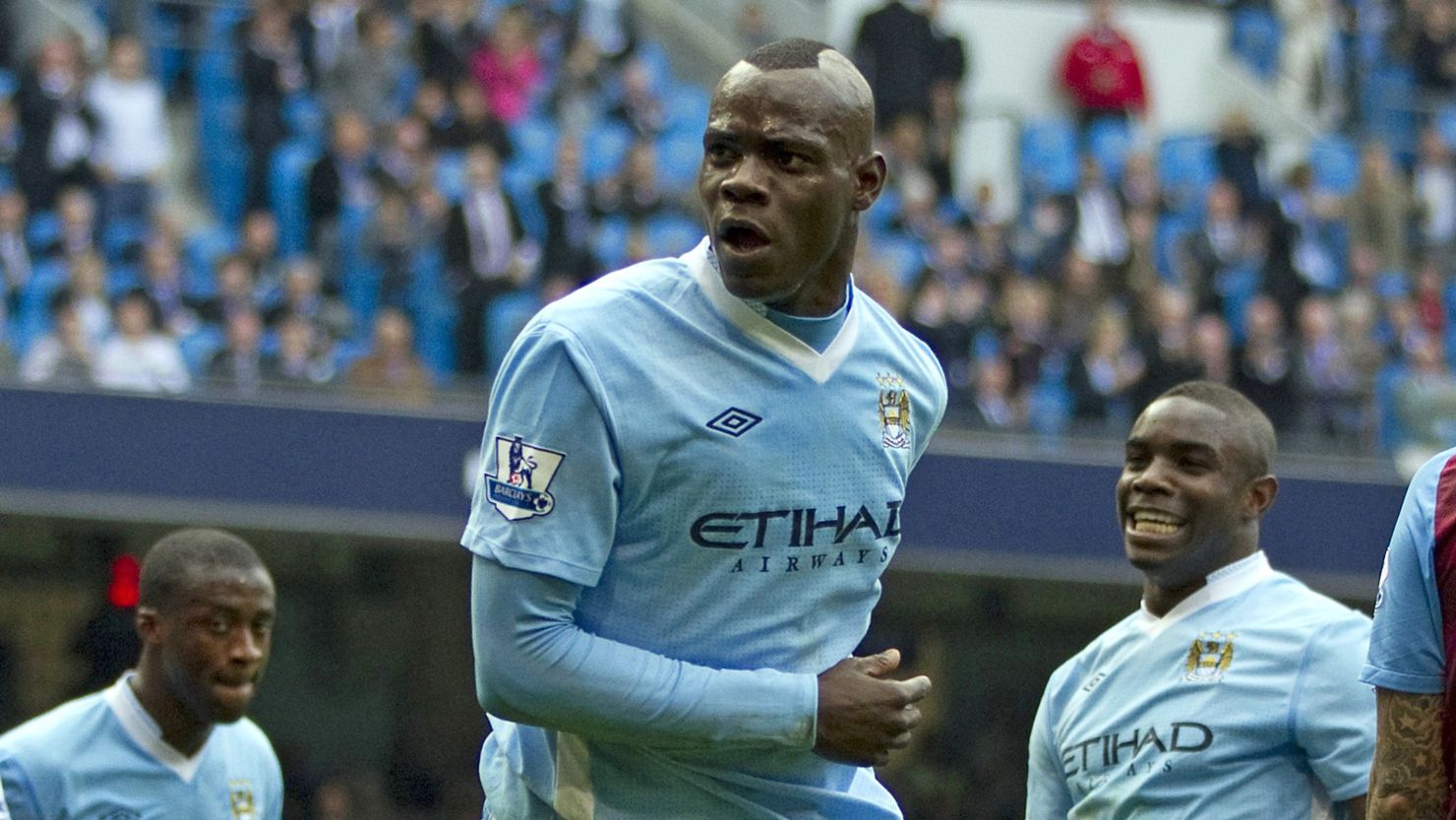 Mario Balotelli gestures after scoring Manchester City's opener against  Aston Villa.