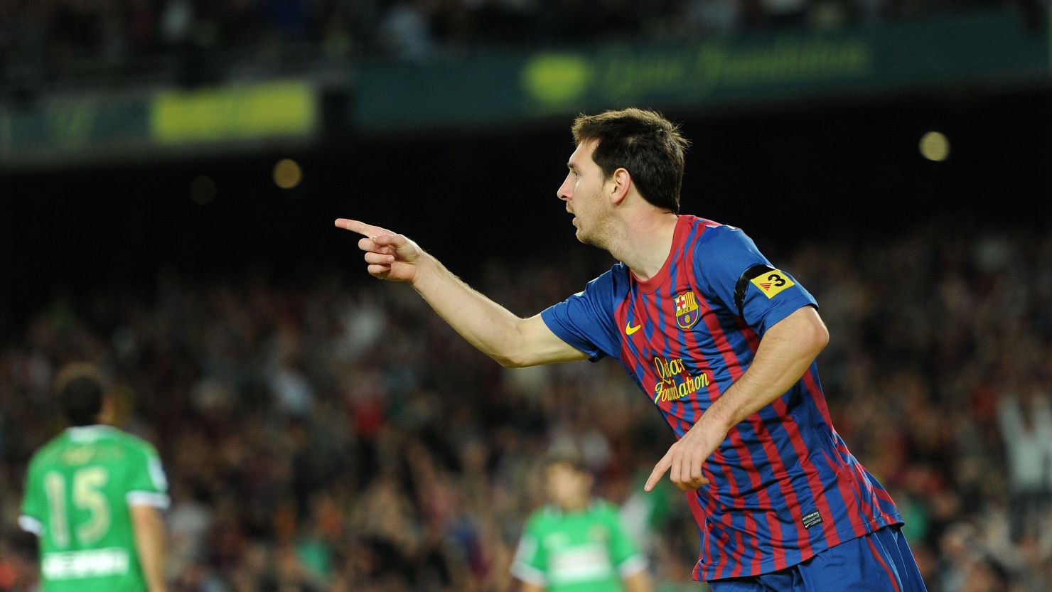Lionel Messi celebrates yet another goal in the 3-0 win over Racing Santander.
