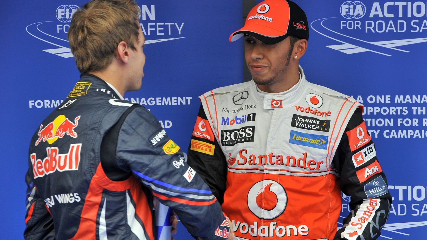 Lewis Hamilton is congratulated by Sebastian Vettel after claiming pole position in Korea.