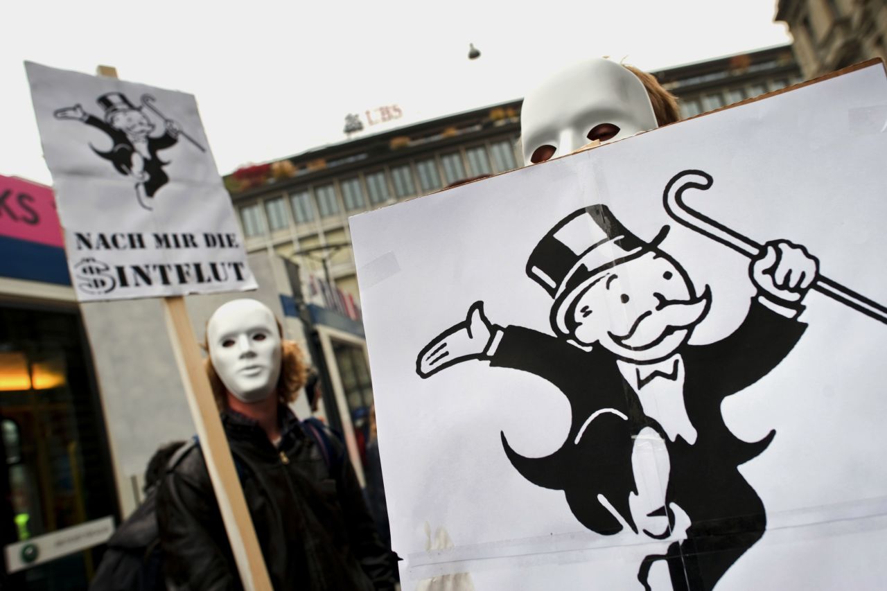 Protesters in Zurich, Switzerland, march against the banking industry and U.S. authorities.