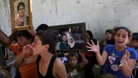 Palestinian children cheer for the release of Ahlam Tamimi (shown in photo), imprisoned for a 2001 bombing that killed 16.