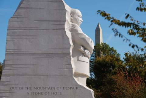The memorial site, which features a striking 30-foot statue of King gazing out over the Tidal Basin, lies between the Lincoln Memorial and the Jefferson Memorial on the National Mall. The statue, representing a "Stone of Hope," sits forward from a "Mountain of Despair."