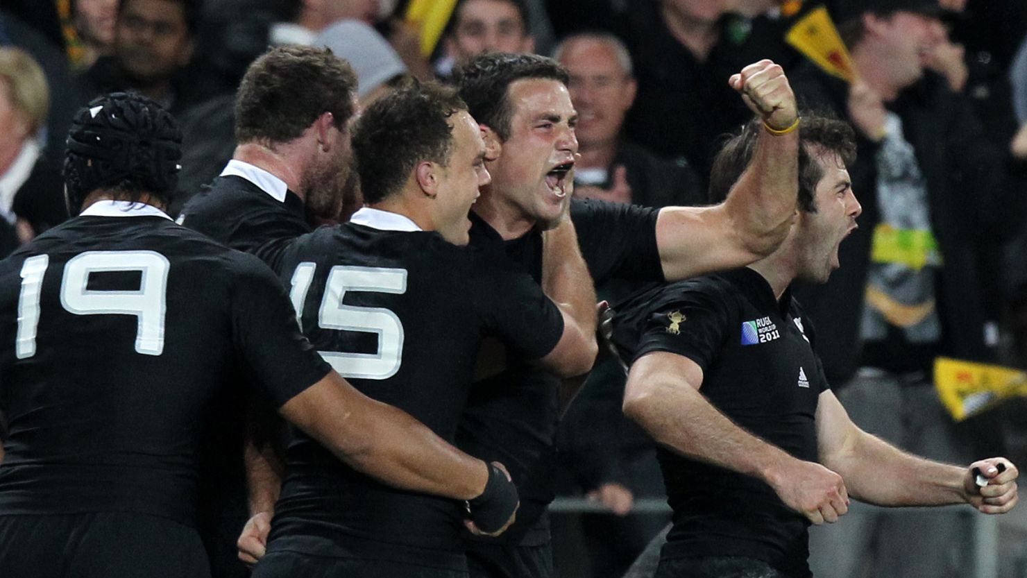 The New Zealand All Blacks celebrate their 20-6 semifinal win over Australia.