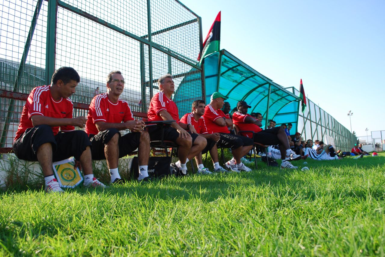 The coaching staff, including coach Marcos Paqueta, watch on as the team plays its final warm-up match against Avenir Sportif De La Marsa. Two of Libya's players are injured in the first half and cannot travel to Zambia, including goalkeeper Guma Mousa. He had come back from fighting on the front line unscathed. Libya won 3-2.