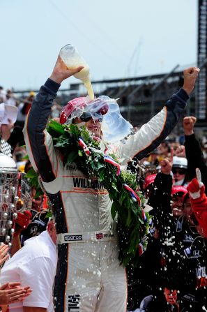 Wheldon celebrates his Indianapolis 500 victory on May 29 with the traditional bottle of milk. Unlike previous winners, he chose to bathe in it.