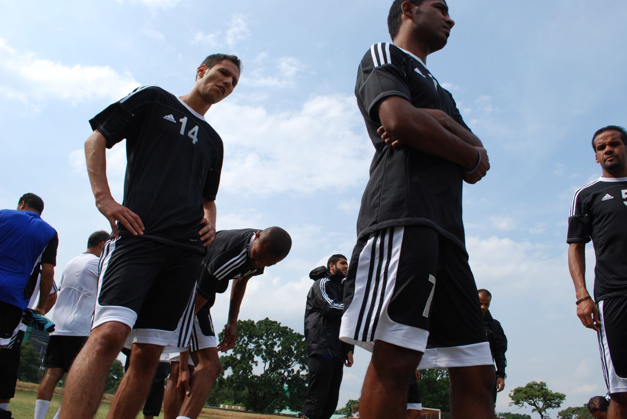 After a near 24-hour journey from Tunis, the squad struggles in the afternoon heat.