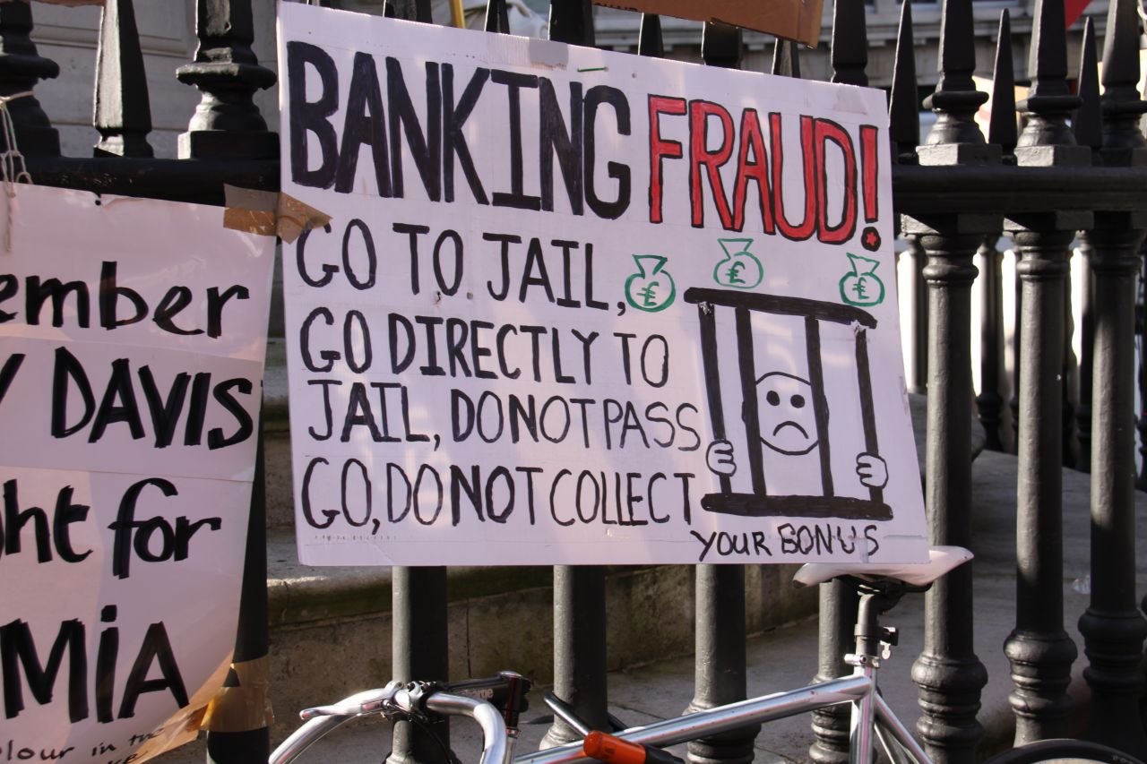 Anti-banking poster at the Occupy London tent village outside St Paul's Cathedral. 