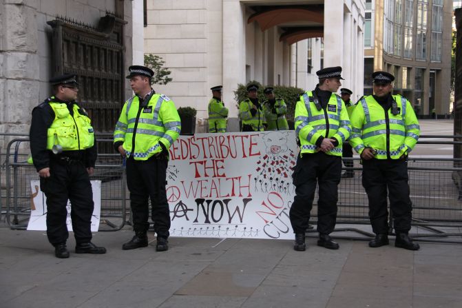 Police officers have been called in, but the peaceful nature of the protests means they are simply standing and watching events unfold.