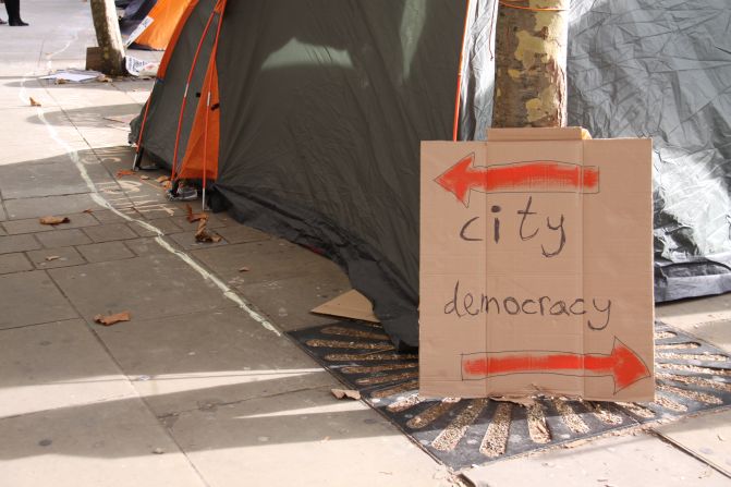 The protesters have festooned buldings and statues in the area with placards and posters.