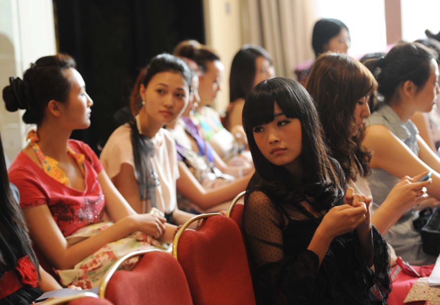 In a picture taken on June 21, 2011 young Chinese women wait their turn during a qualifying for the Miss Chinese Cosmos beauty pageant in Beijing.