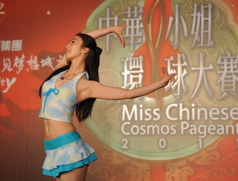 In a picture taken on June 21, 2011 a young Chinese woman performs on stage during a qualifying for the Miss Chinese Cosmos beauty pageant in Beijing.