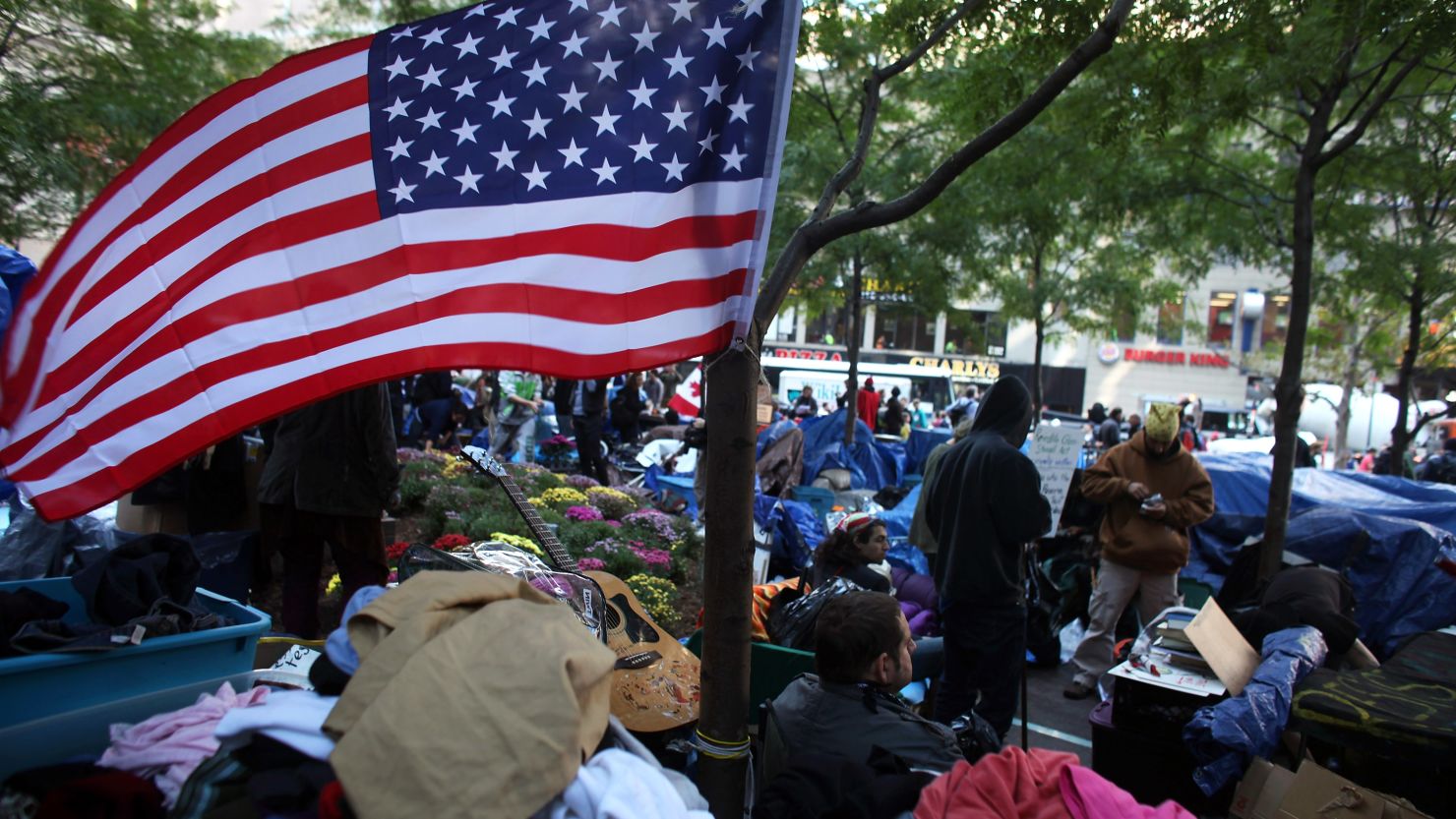 Occupy Wall Street protesters remain in New York's Zuccotti Park on Monday, 31 days after the movement began.