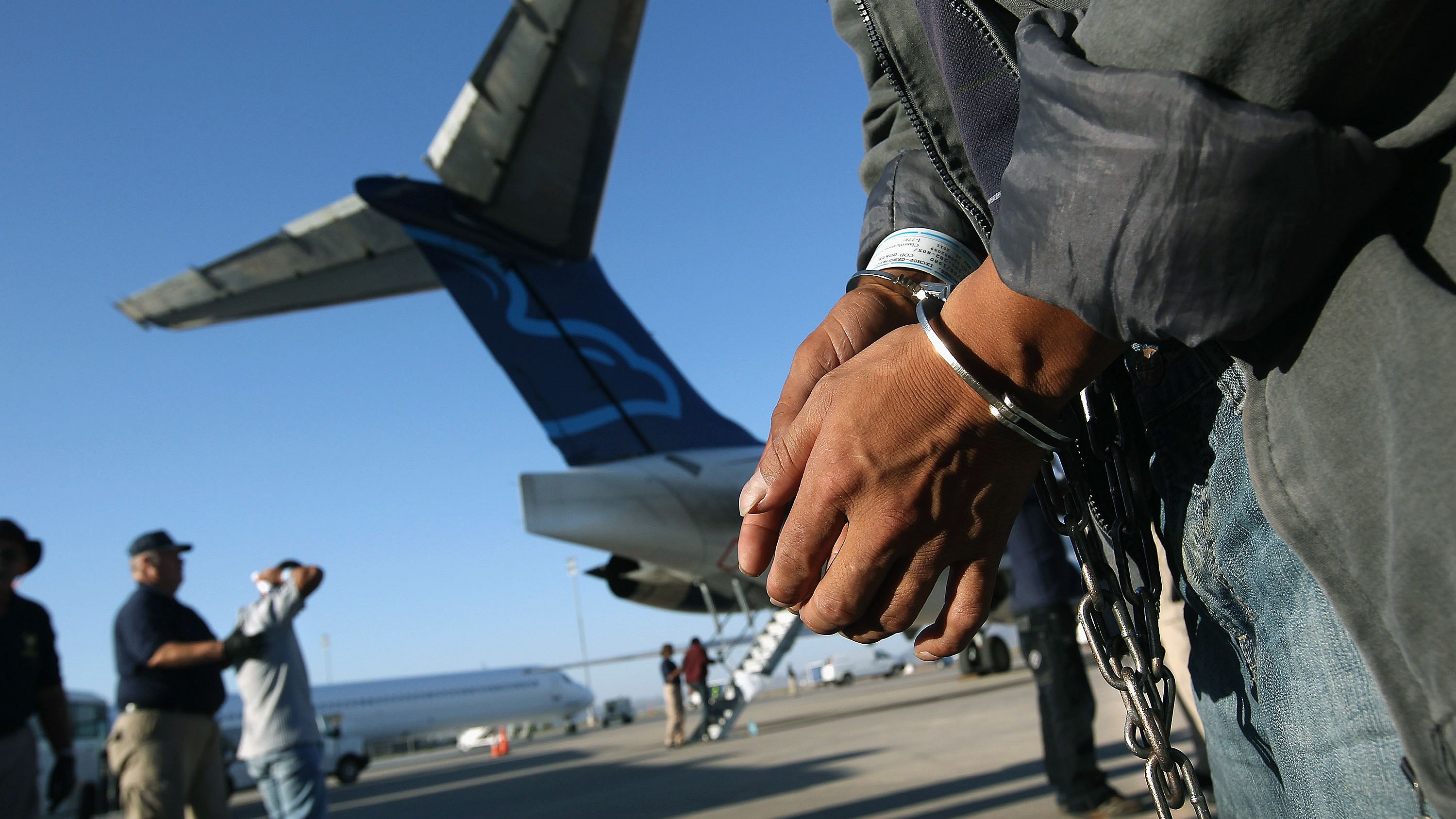 An undocumented Guatemalan charged as a criminal prepares to board a deportation flight in Mesa, Arizona, this summer.