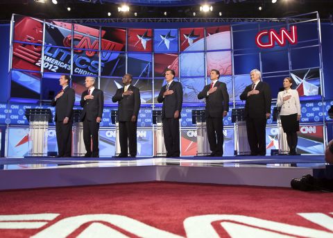 The GOP presidential candidates say the Pledge of Allegiance before the debate.