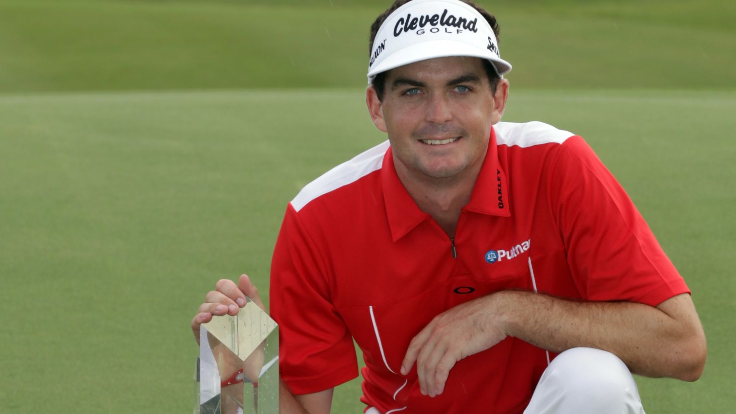 Keegan Bradley proudly displays his winning trophy at the Grand Slam of Golf