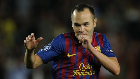 Andres Iniesta strikes a fighting pose after scoring for Barcelona in the Nou Camp