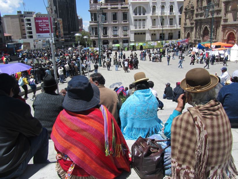 Residents of La Paz watch protesters in Plaza San Francisco demonstrate against the construction of a proposed road. The plaza is the city's biggest open public space.