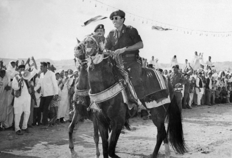 Gadhafi rides a horse through Tripoli in November 1975.