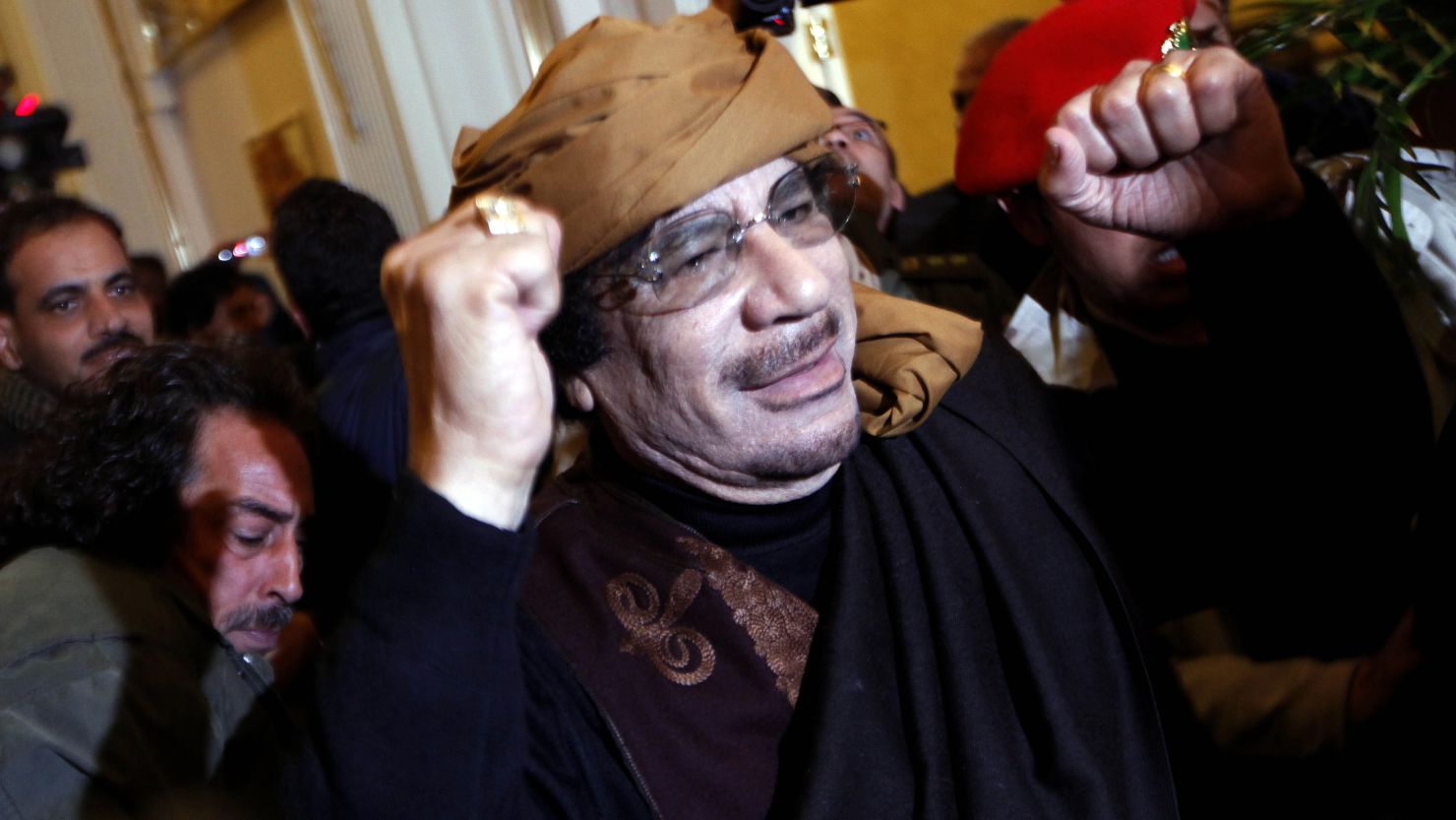 Questions surround the circumstances of the death of former Libyan leader Moammar Gadhafi, pictured here in March.