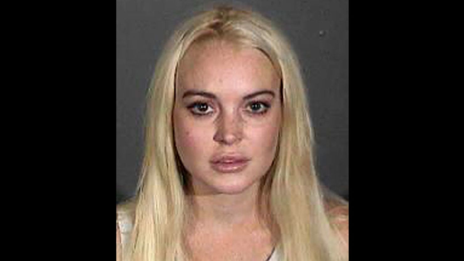 Lindsay Lohan must work two shifts a week at the Los Angeles County morgue until a probation revocation hearing in November.