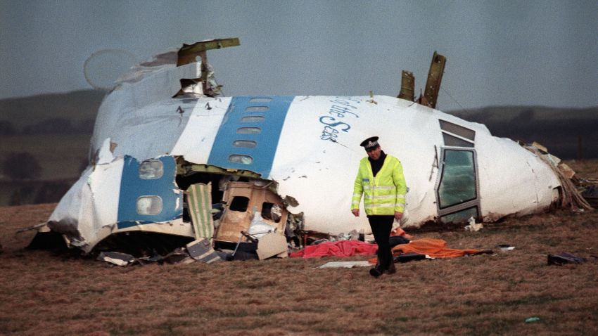 A policeman examines the site where a Boeing 747 crashed after exploding over Lockerbie, Scotland, in December 1988. The incident left 270 people dead.