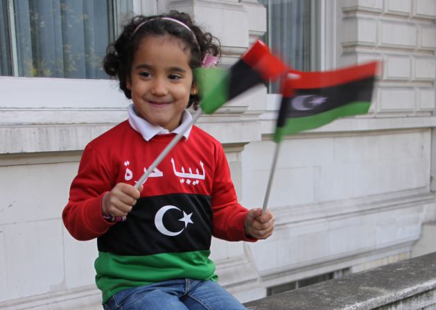 Four-year-old Selsabeel Ageli, whose parents say spent months praying for Libyan dictator Moammar Gadhafi to die, celebrates outside the Libyan Embassy in London.