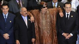 Libyan leader Moammar Gadhafi leans on Egyptian President Hosni Mubarak and Yemeni President Ali Abdullah Saleh in the 2nd Afro-Arab Joint Summit in Sirte, on October 10, 2010.