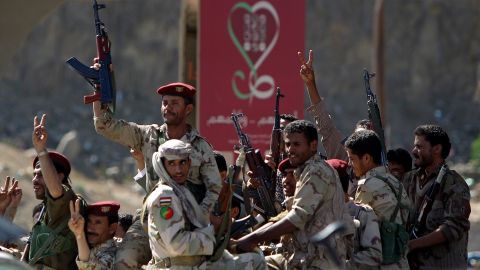 Yemeni dissident soldiers salute anti-government protesters Friday in Sanaa.