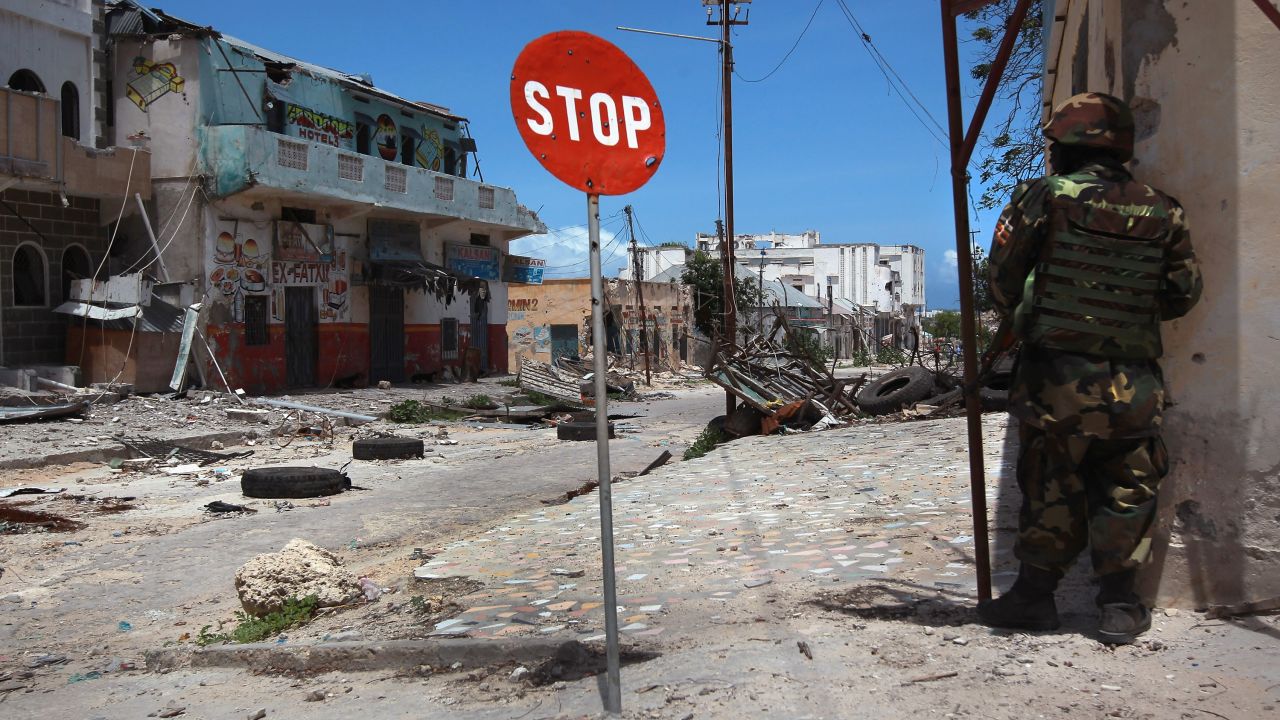 An African Union soldier guards a street corner in Mogadishu, Somalia, in August 2011, after Al-Shabaab militants withdraw.