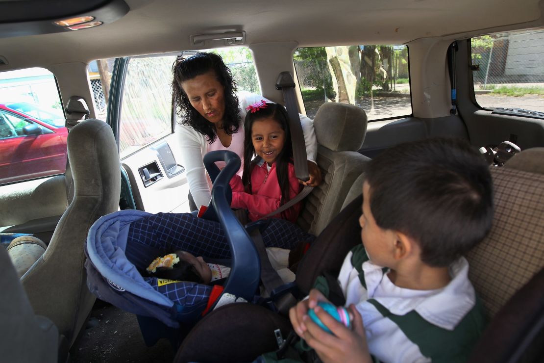 Mexican immigrant Jeanette Vizguerra loads her children into her car after a meeting at the Mexican consulate in her fight against deportation hearings on May 23, 2011, in Denver. 