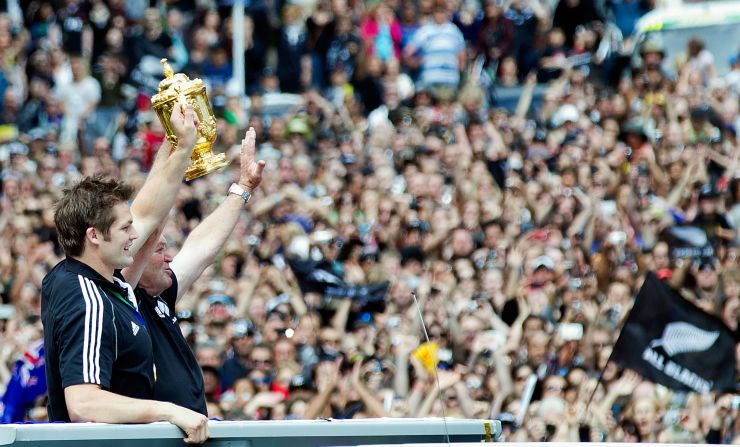 Captain and coach Richie McCaw and Graham Henry take the plaudits from the jubilant fans