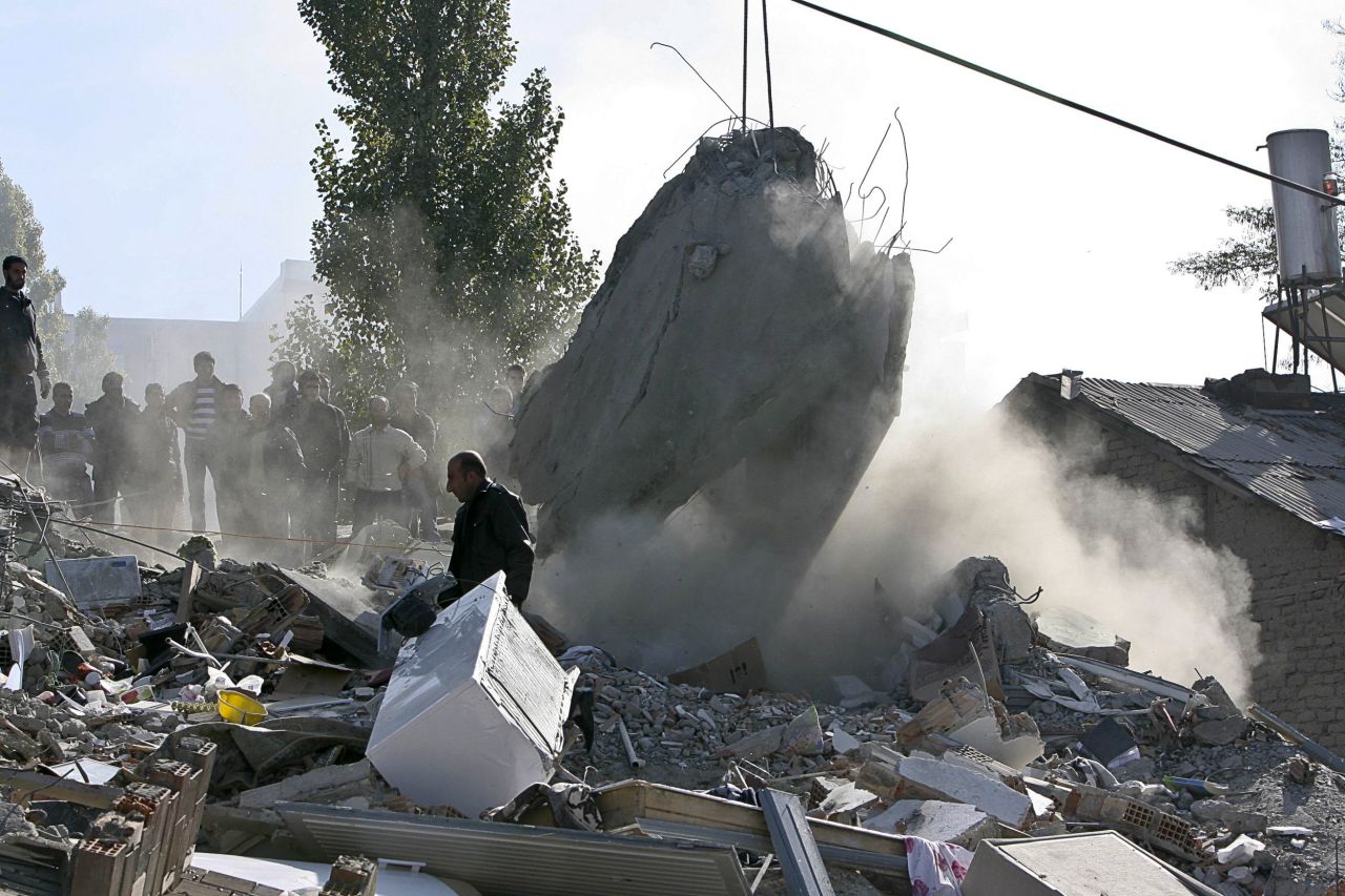 A man walks through the rubble in Van on Monday.