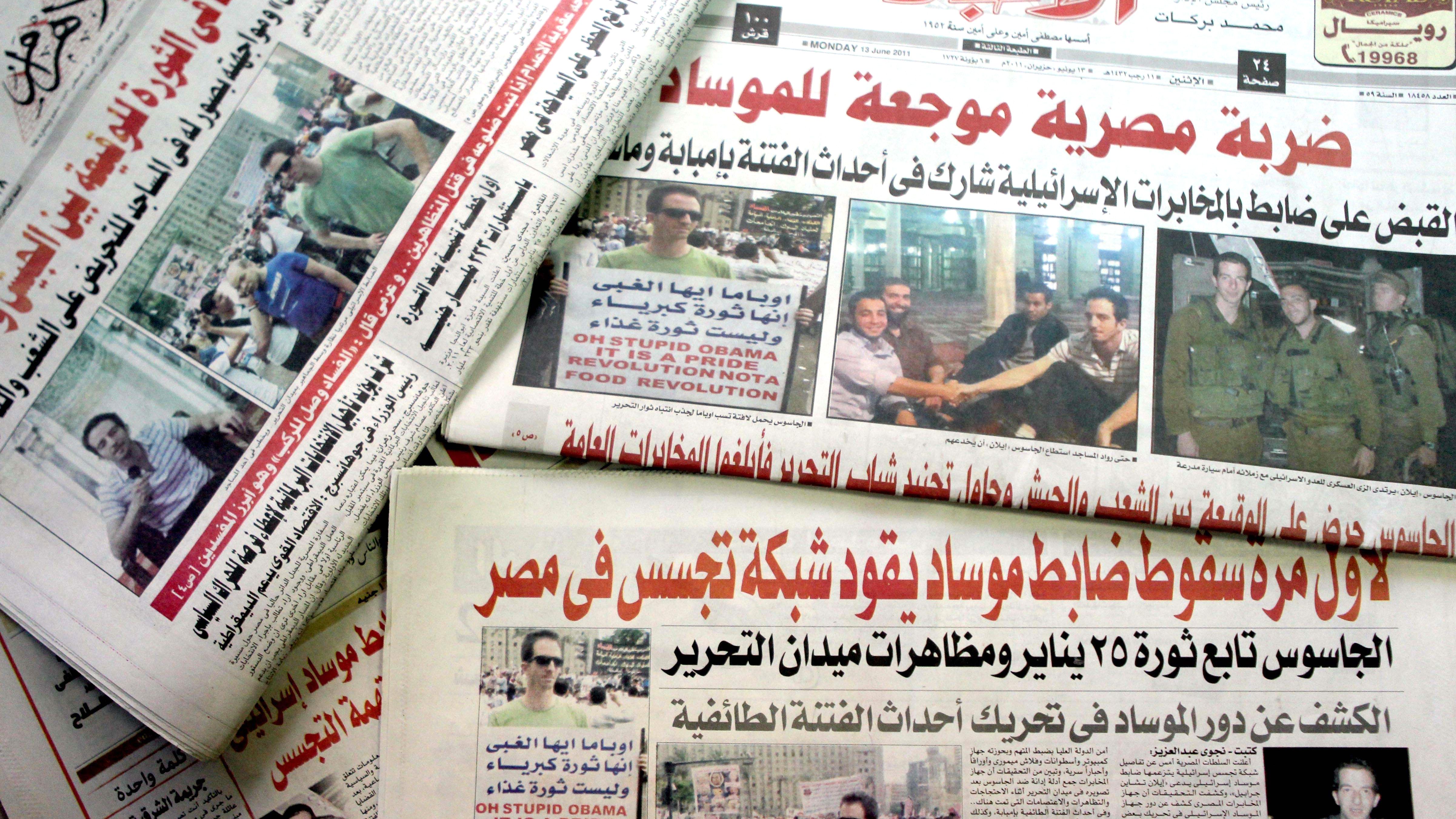 Ilan Grapel, a U.S.-Israeli citizen arrested June 12 on suspicion of spying, is pictured on Egyptian newspapers dated June 13.
