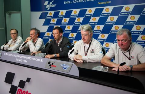 Race officials at a press conference to announce the death of Italian rider Simoncelli.