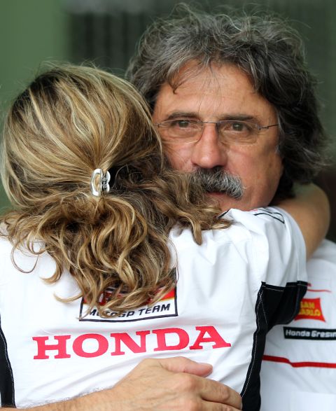 Marco's father Paolo Simoncelli is comforted after learning of his son's death.