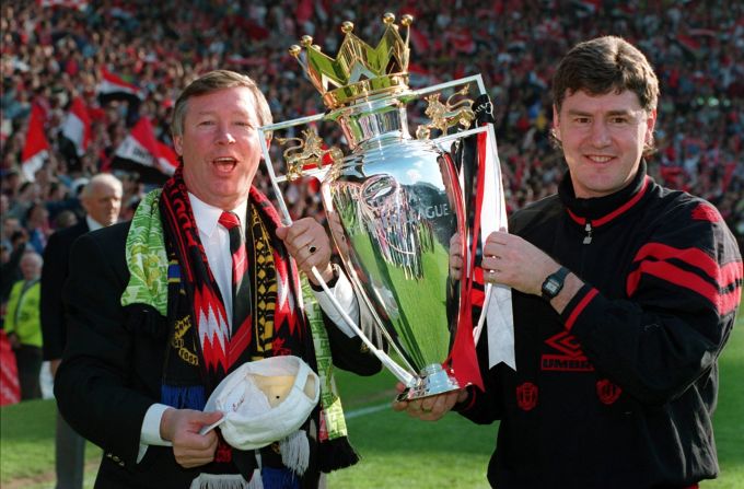 Ferguson celebrates with his assistant Brian Kidd after United won the Premiership again in 1994, then went on to secure a domestic double by beating Chelsea in the FA Cup final. United repeated the feat in 1996.