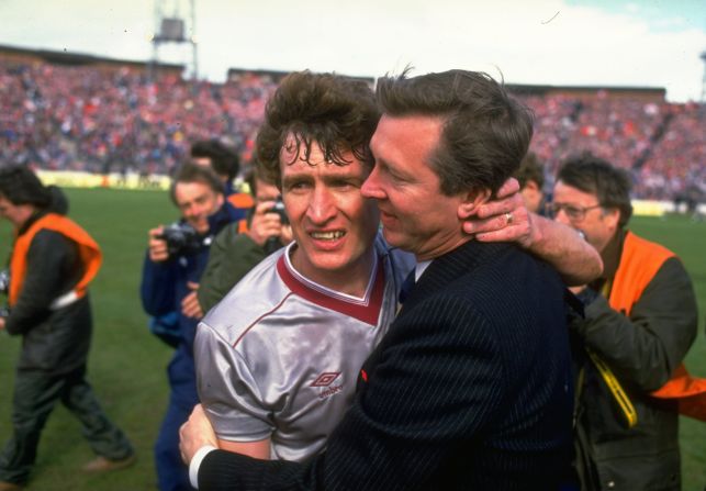 Ferguson hugs Sandy Jardine (left) of Hearts after guiding Aberdeen to a fourth Scottish Cup win in 1986. It was his last success with the Dons, having won three Scottish league titles and the 1983 European Cup Winners' Cup -- beating mighty Real Madrid in the final.