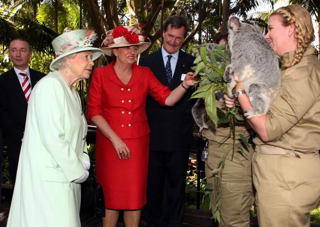 Queensland Premier Anna Bligh shows Queen Elizabeth II a koala during a visit to Rainforest Walk, Southbank, in October 2011, in Brisbane, Australia.