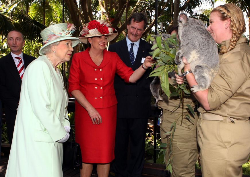 Queensland Premier Anna Bligh shows Queen Elizabeth II a koala during a visit to Rainforest Walk, Southbank, in October  2011, in Brisbane, Australia. 