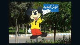 Mickey Mouse welcomes visitors to Tehran's Eram Park.