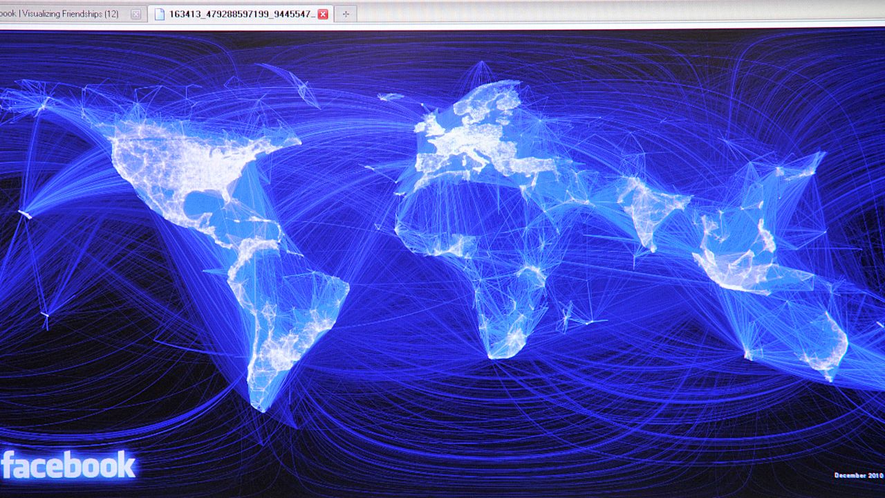 This map shows the global community of Facebook friendships, displayed as lights on a deep  blue background. 