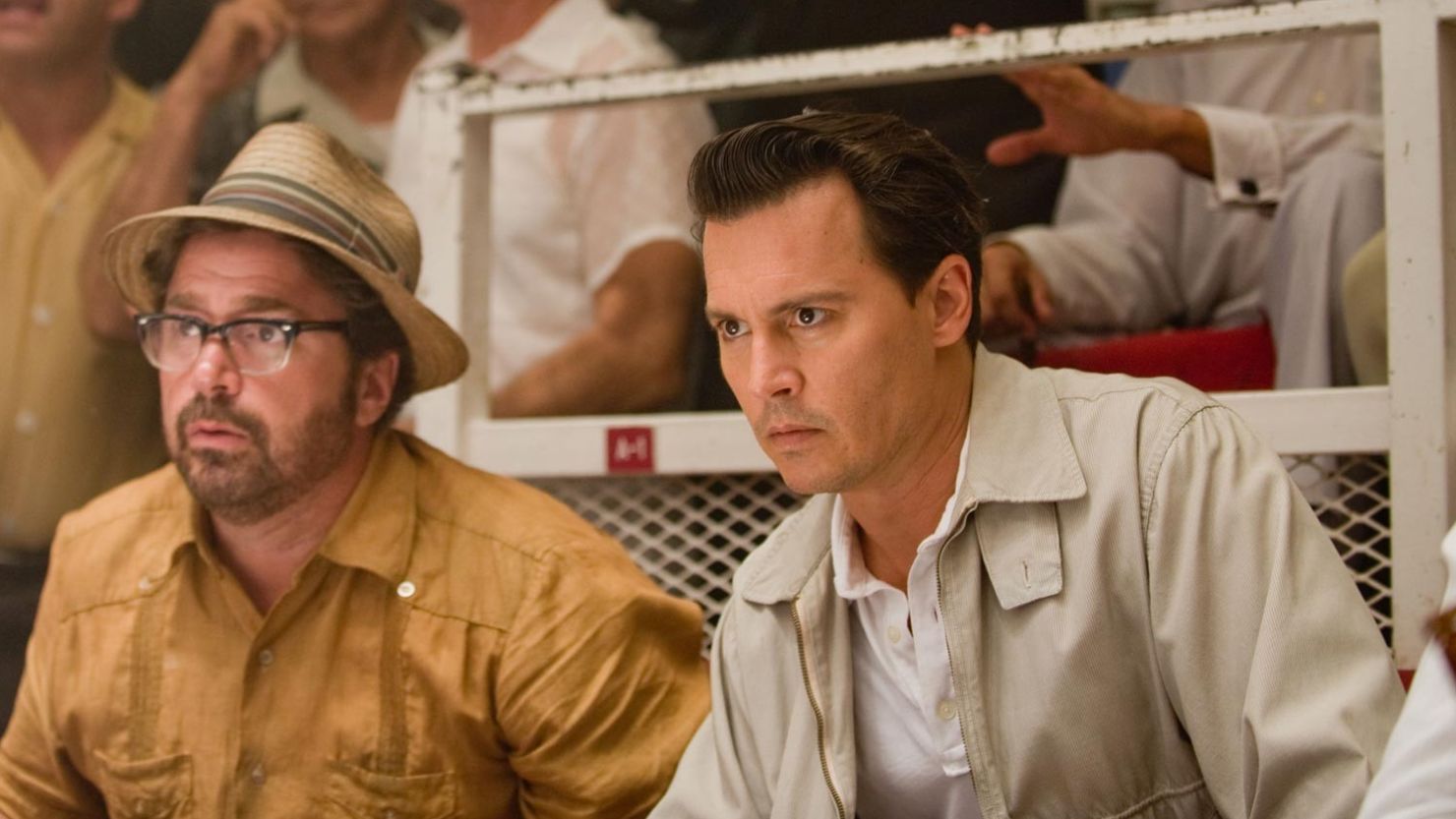 Paul Kemp (Johnny Depp, right) tries to figure out his place in paradise in "The Rum Diary."