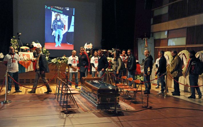 People queue to see Simoncelli's coffin and pay their final respects to their late hero.