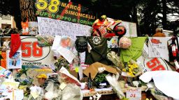 Mourners lay flowers in Marco Simoncelli's hometown of Coriano as a sign of their respect for the former Honda rider.